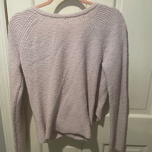 light purple sweater, with open back